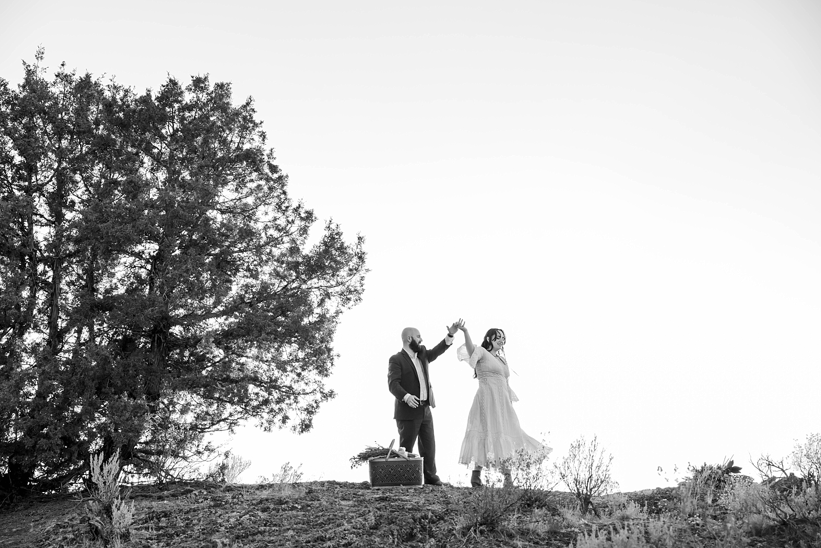 man and woman dancing after outdoor elopement