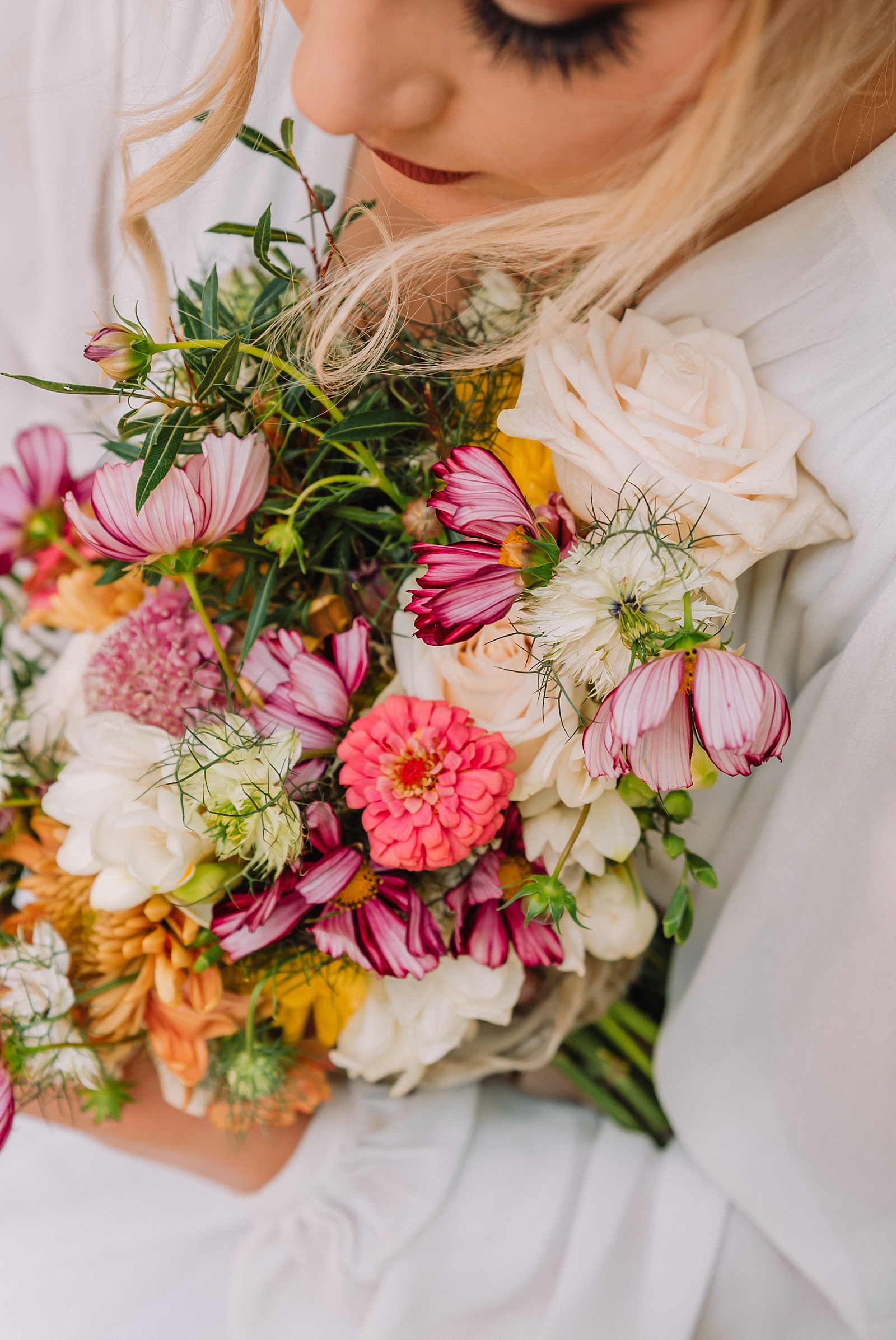 bouquet filled with pinks, white, and green florals for spring florals