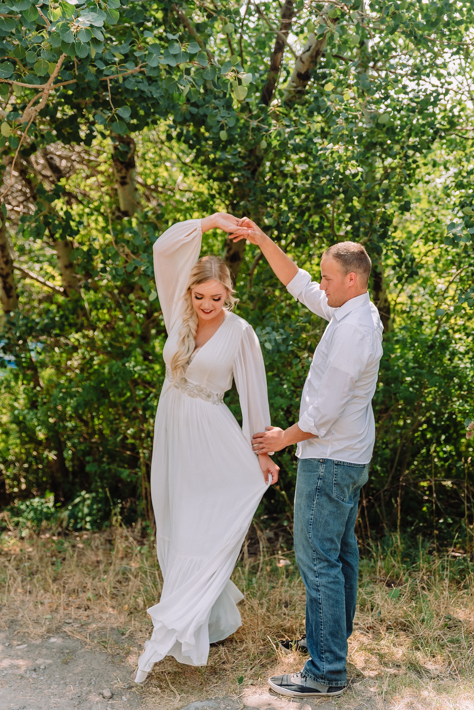 couple dancing in the woods after styled elopement in kelly canyon