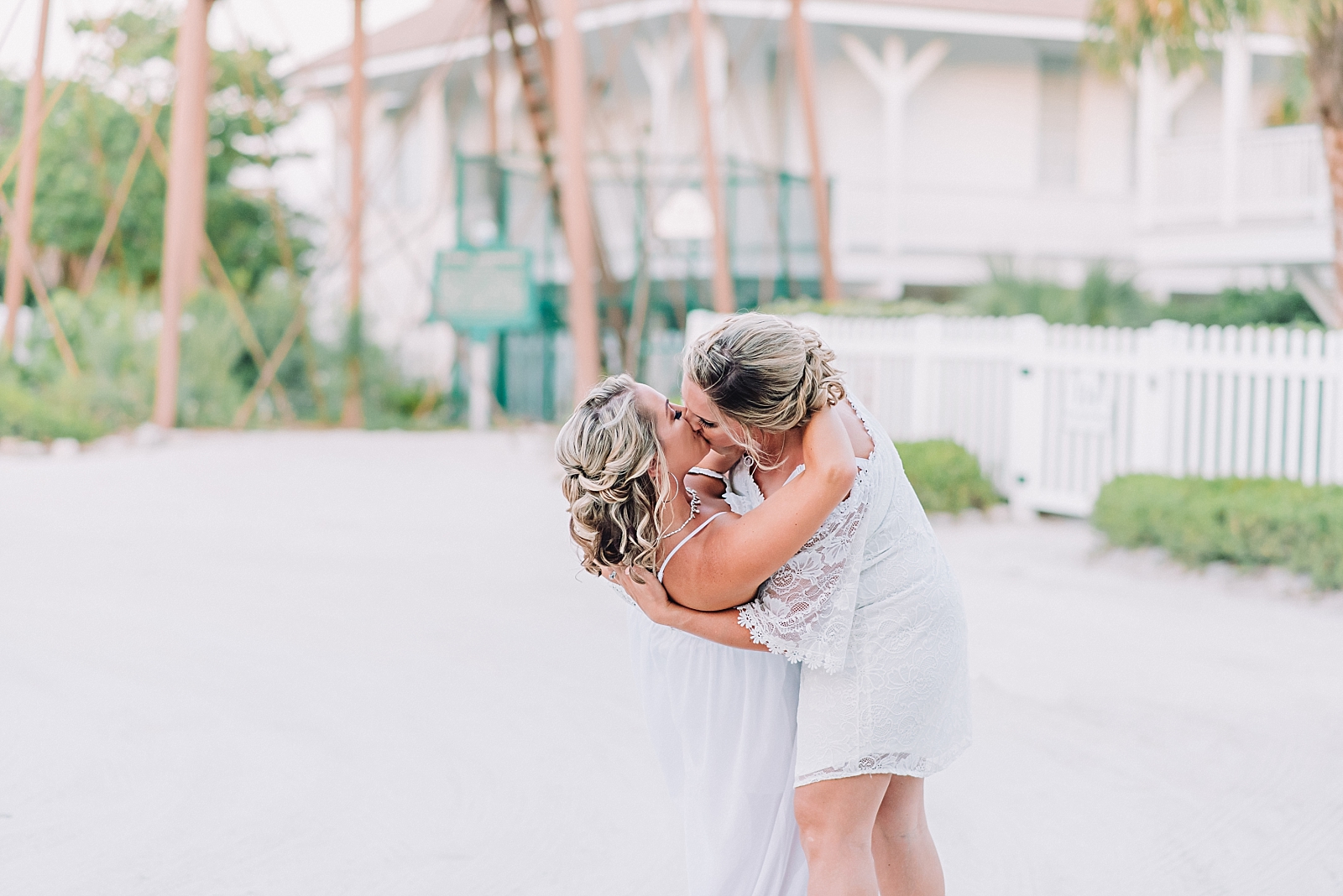 couple kisses at sanibel island lighthouse wedding