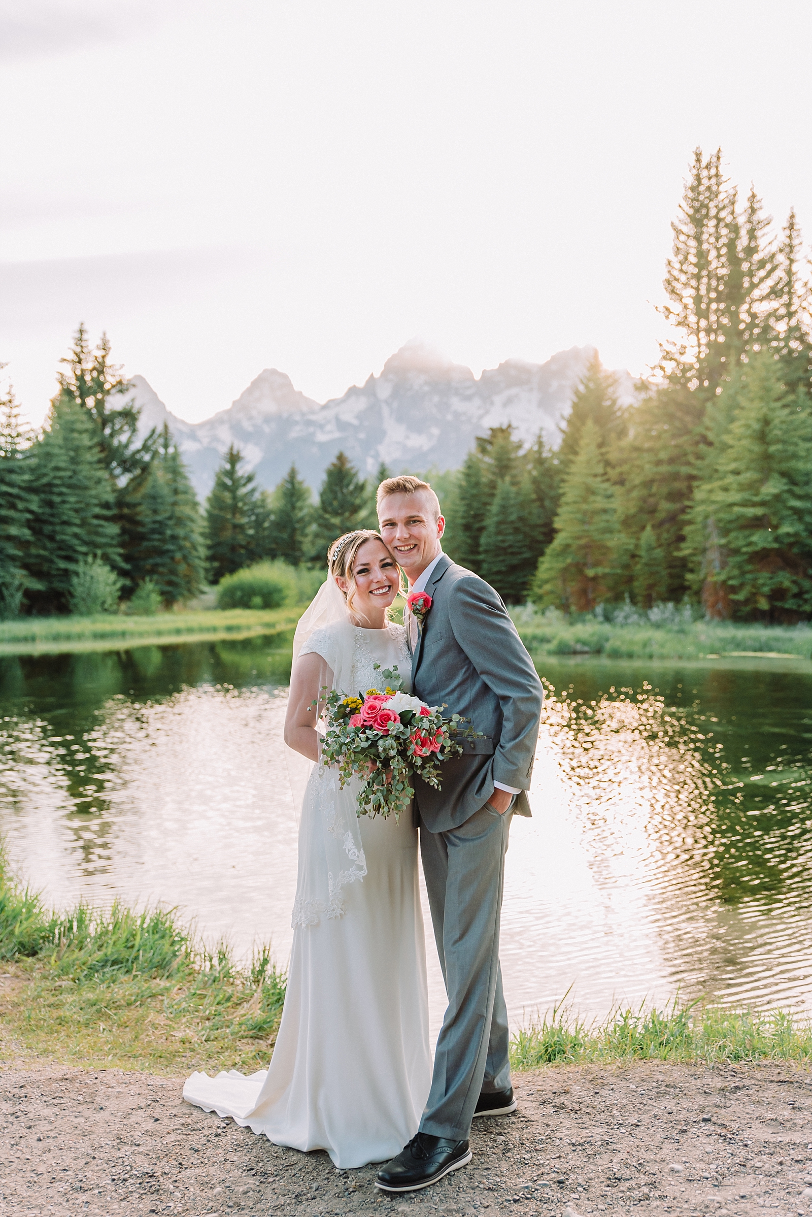 couple in front of beaver pond at schwabacher's landing