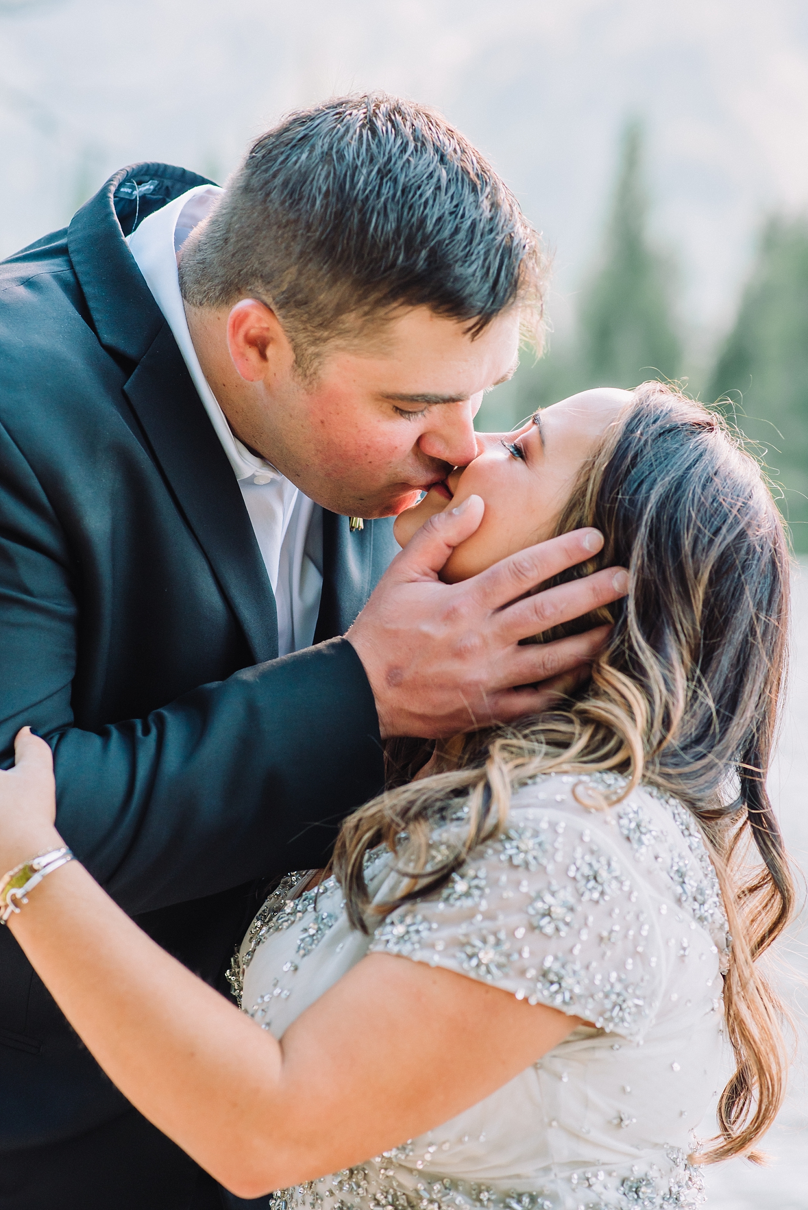 Bride and groom kiss in grand teton national park wedding