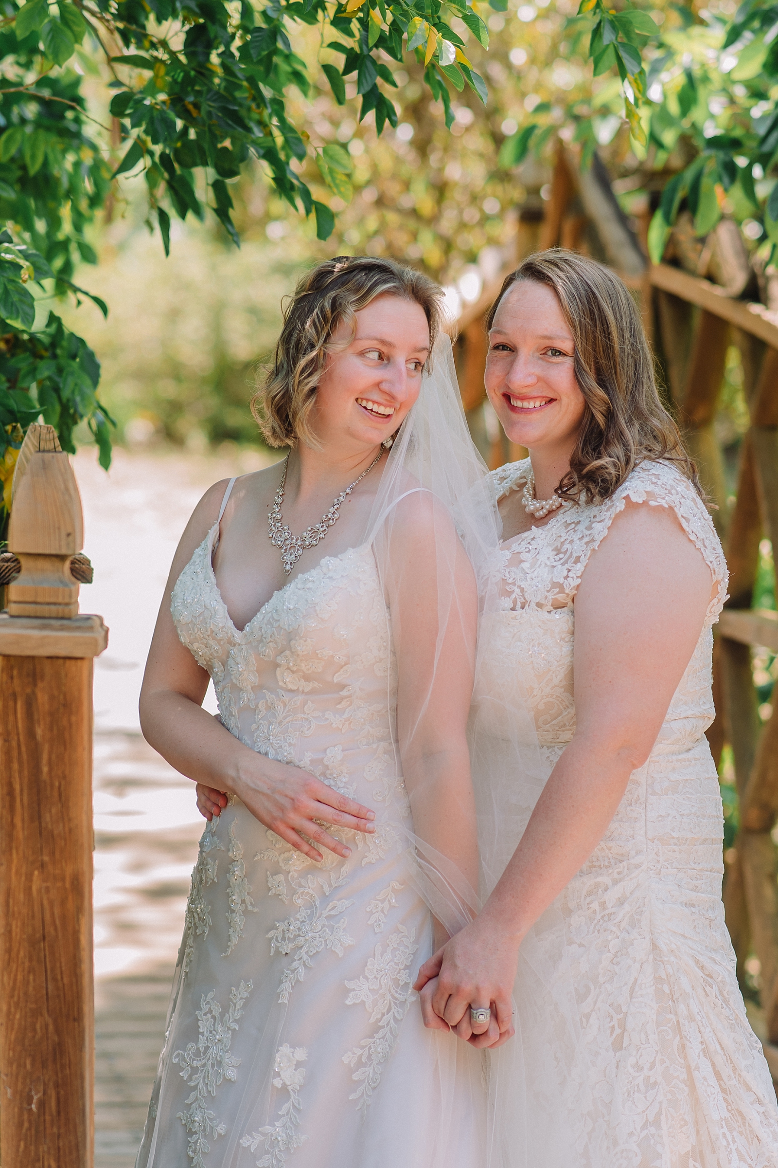 same sex couple in wedding dresses