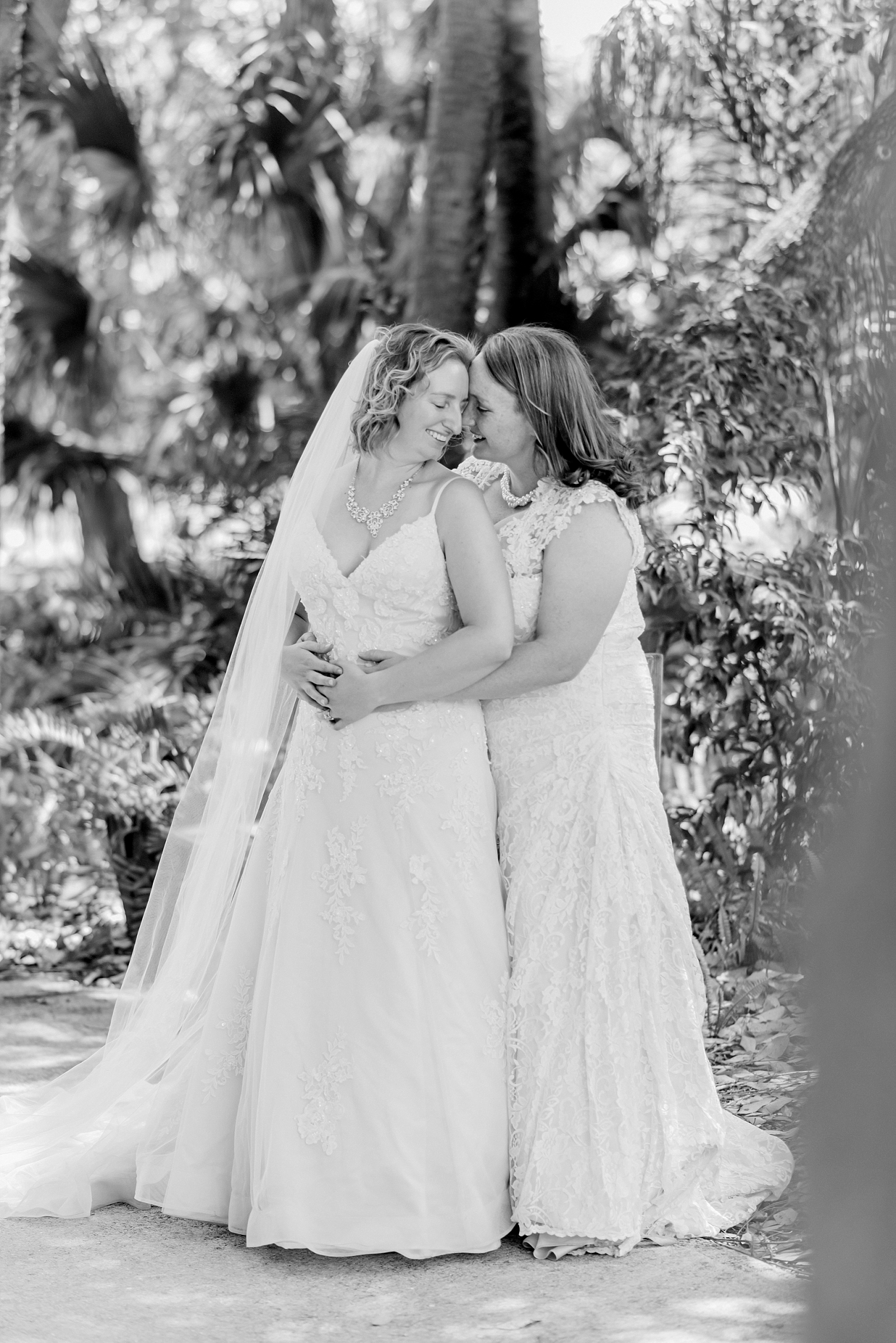 lesbian couple in wedding gowns