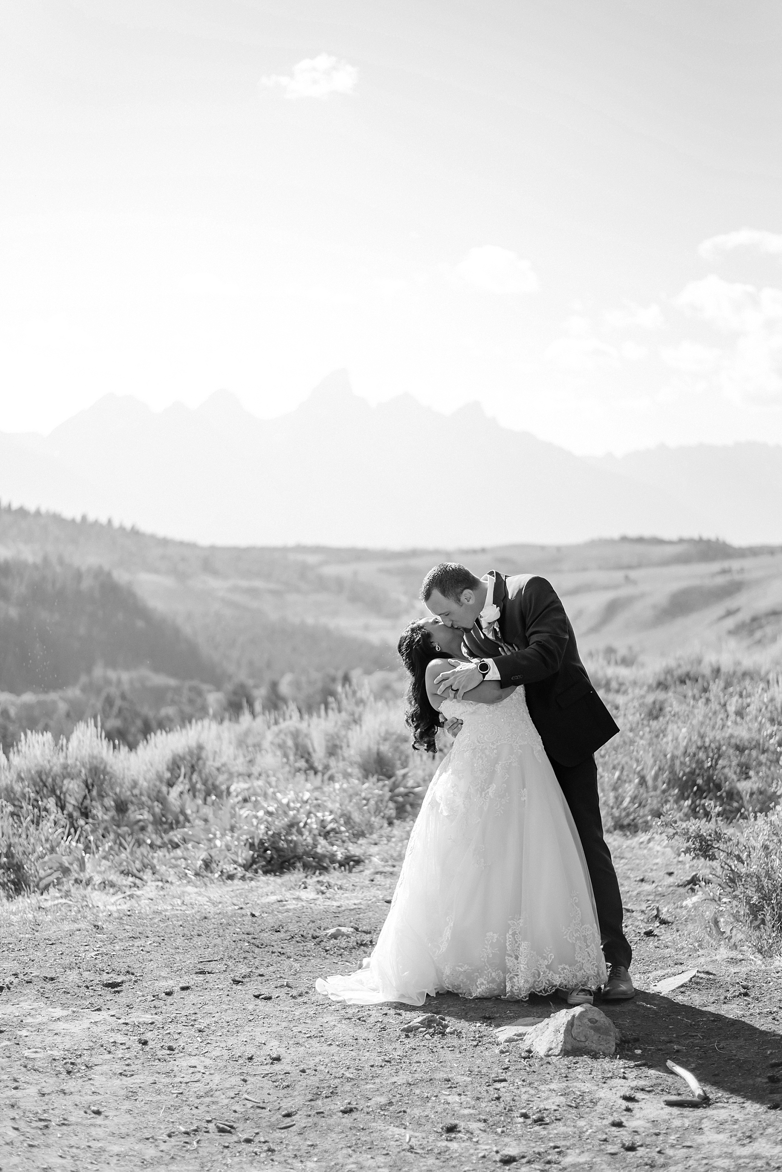 bride and groom kiss in the tetons