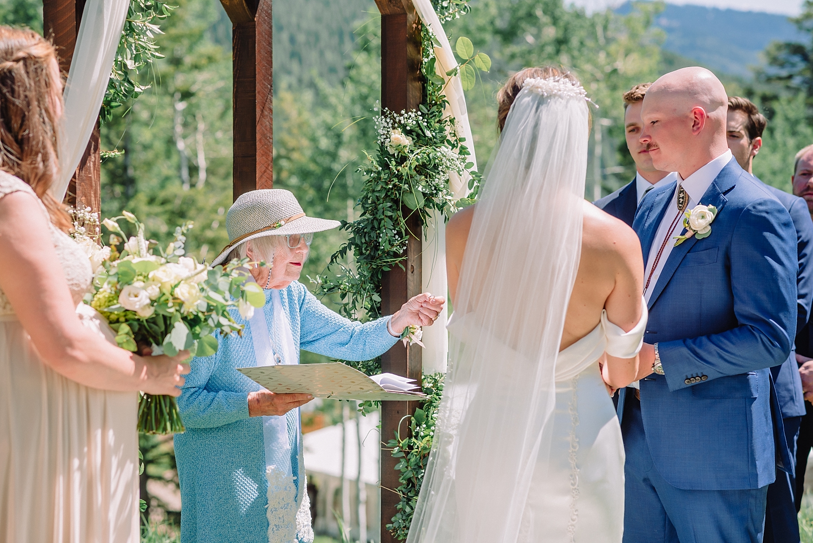 grandma offers wedding rings at ceremony