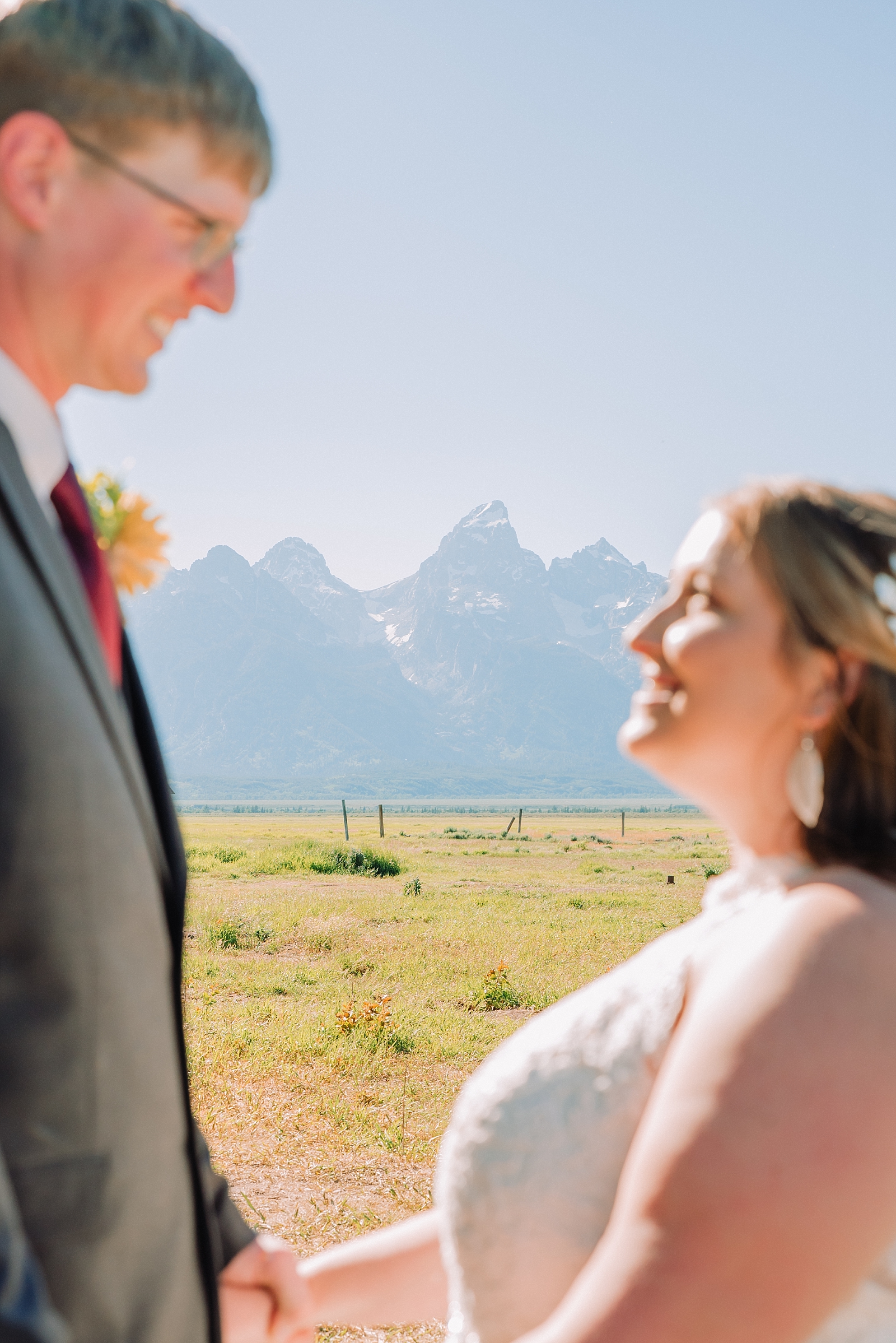 bride and groom with the teton mountains