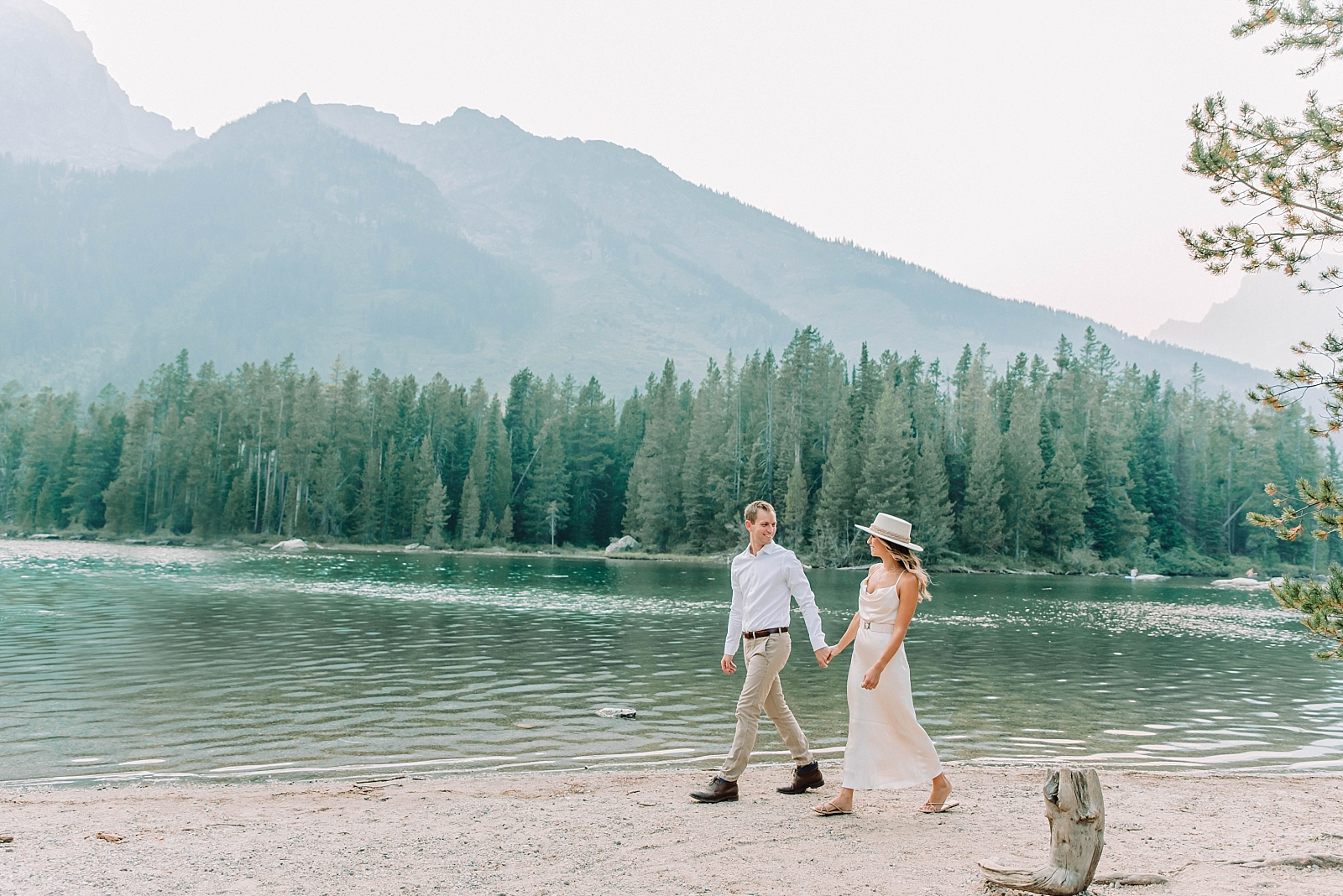 couple walking in grand teton national park on wedding day