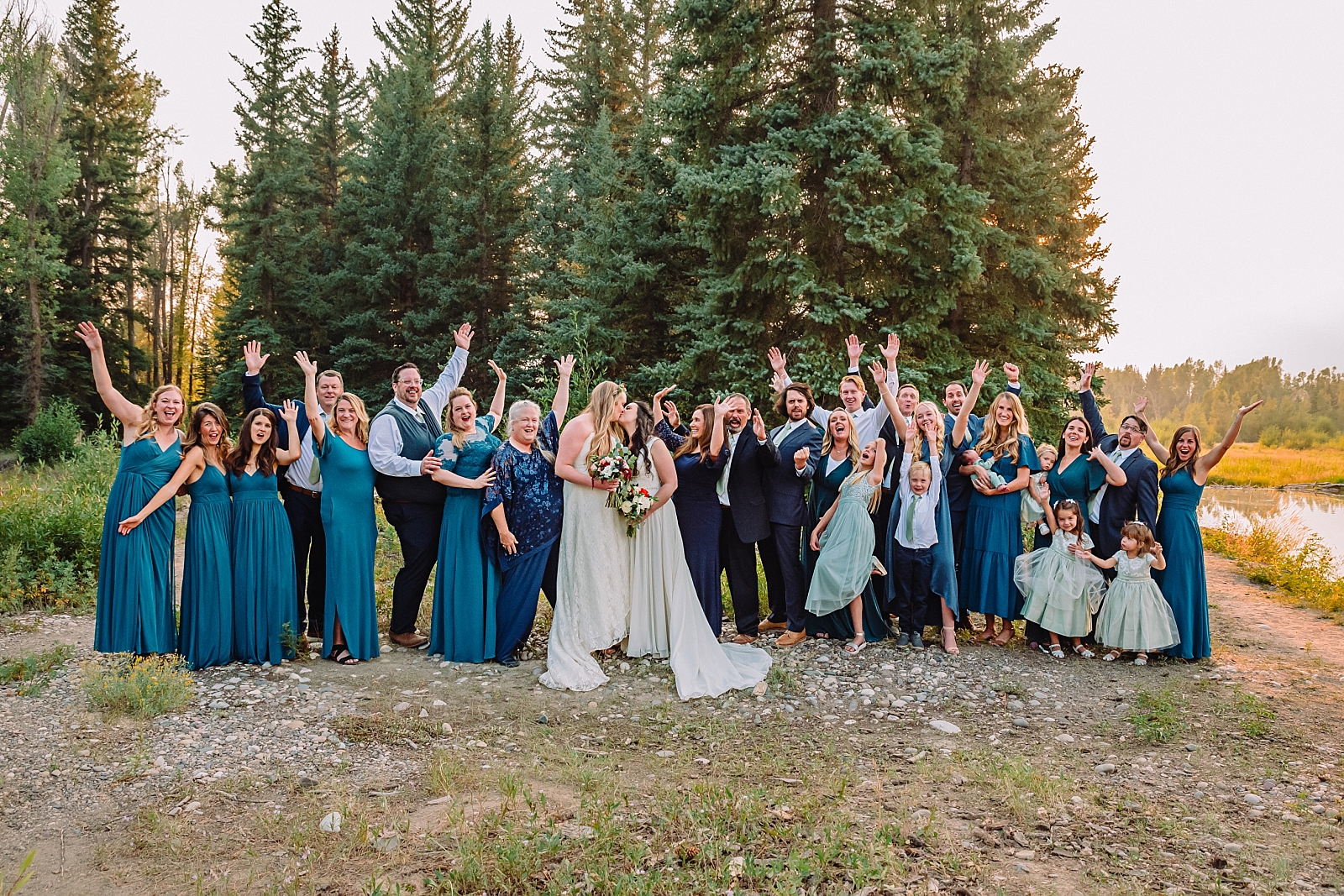 family celebrates with lesbian wedding couple in mountain micro wedding