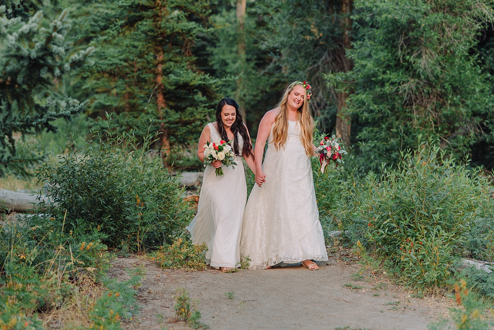 lesbian couple walks up the aisle in mountain micro wedding