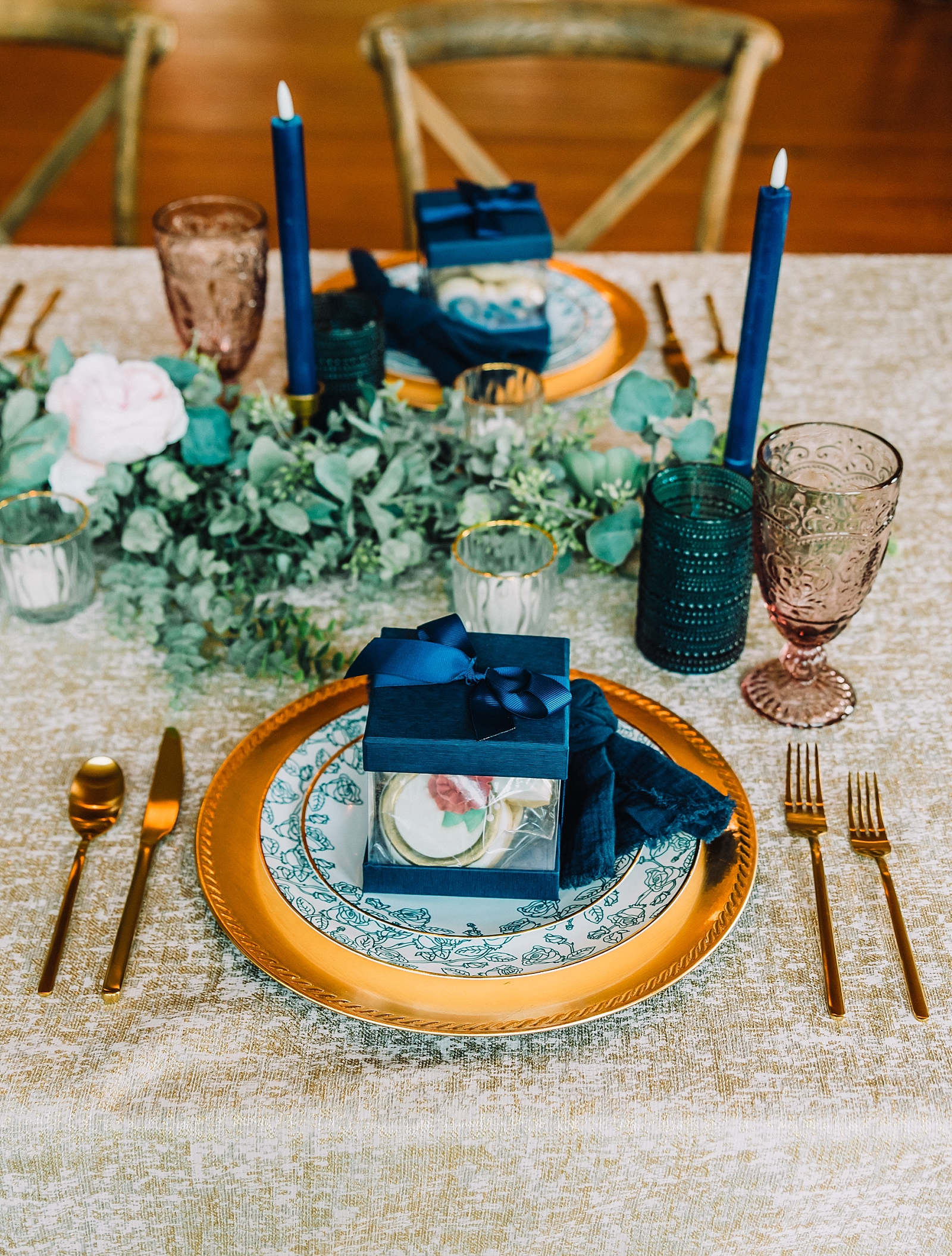 greenery and metallic chargers at spring wedding