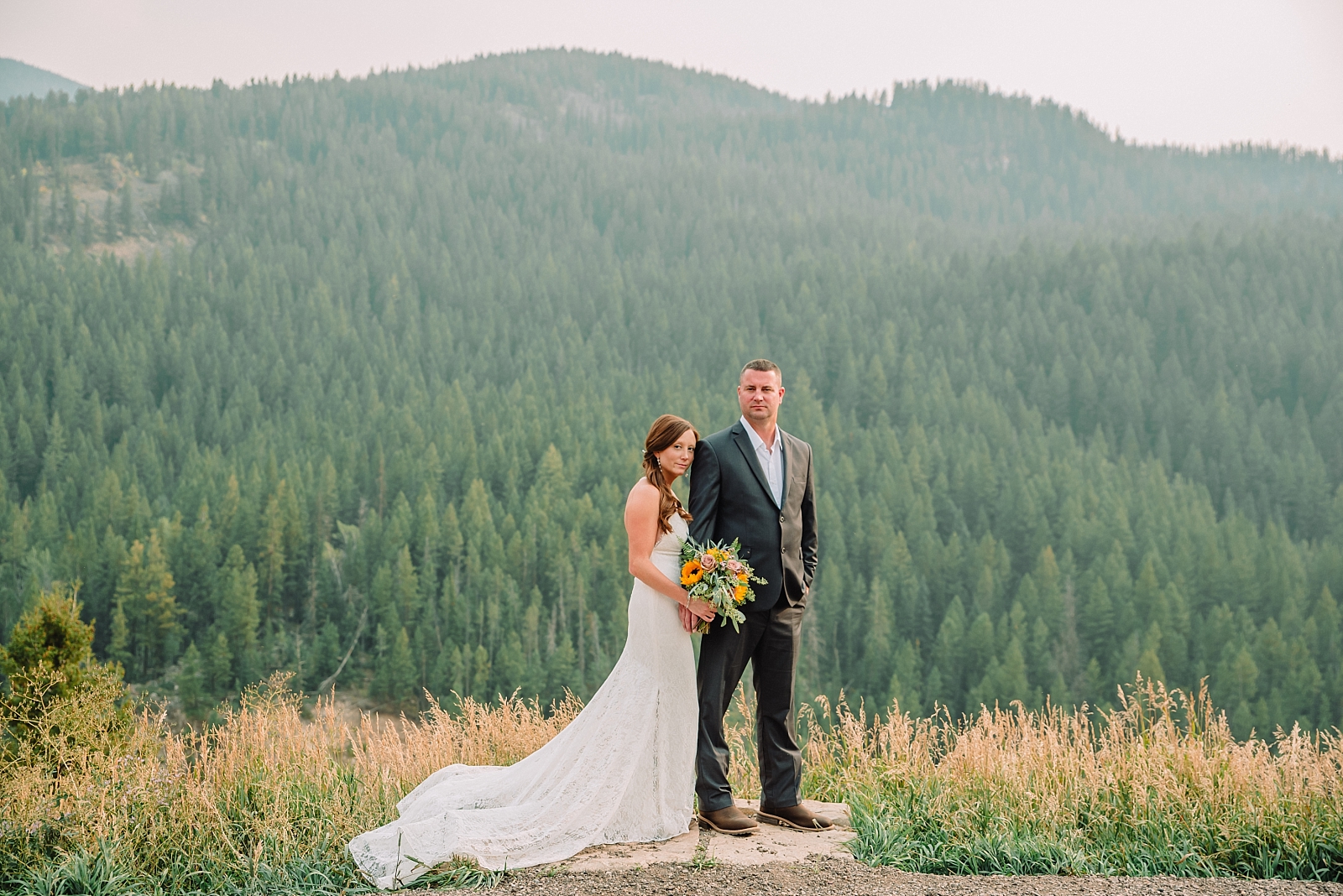 bride and groom in forest mountain elopement