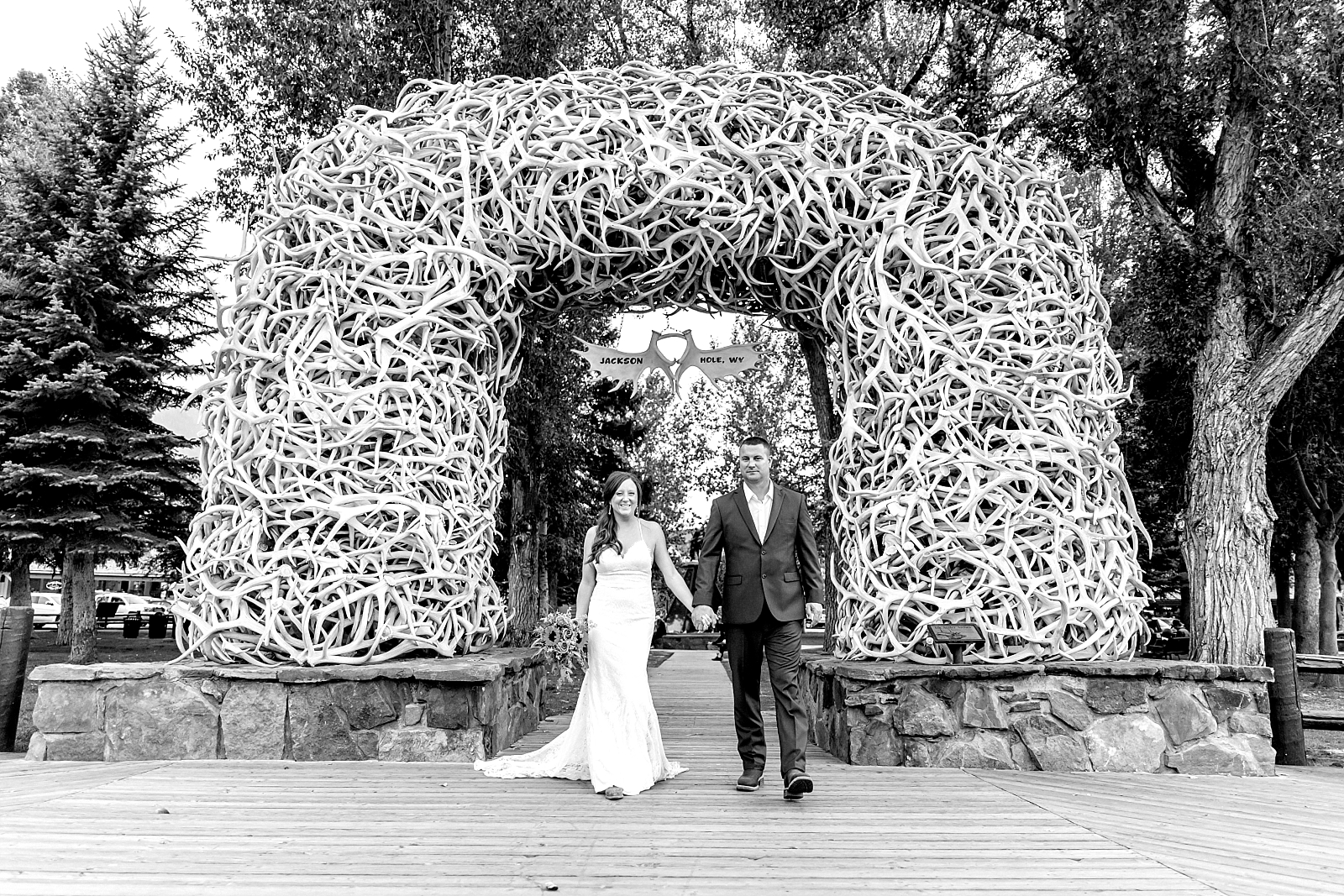 couple under antler arches