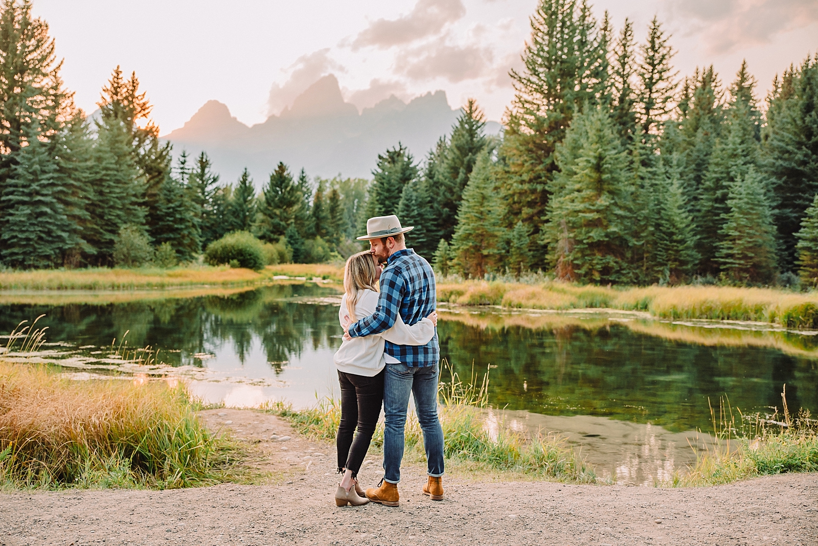couple embracing during outdoor activities in jackson hole
