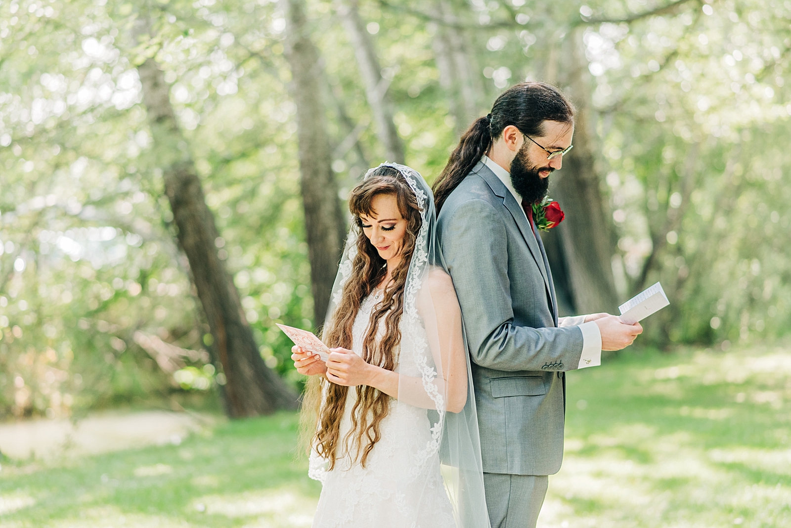 bride and groom read special notes on wedding day
