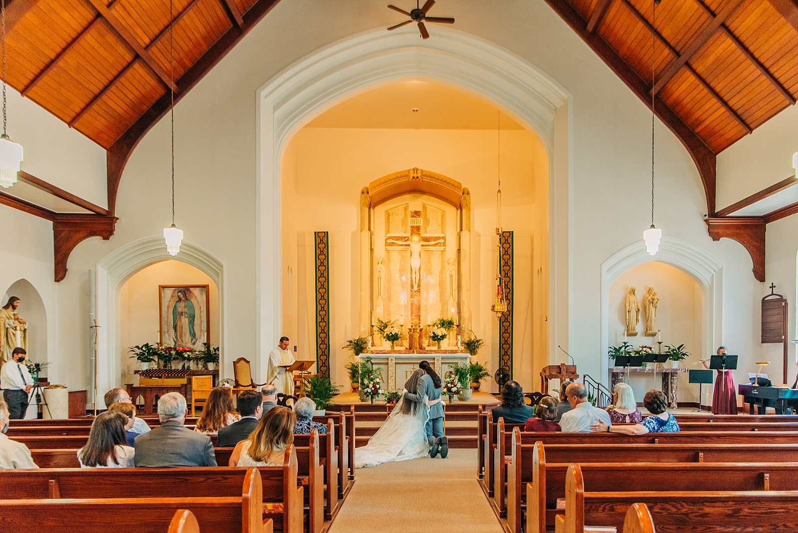 bride and groom in Holy Rosary Catholic Church