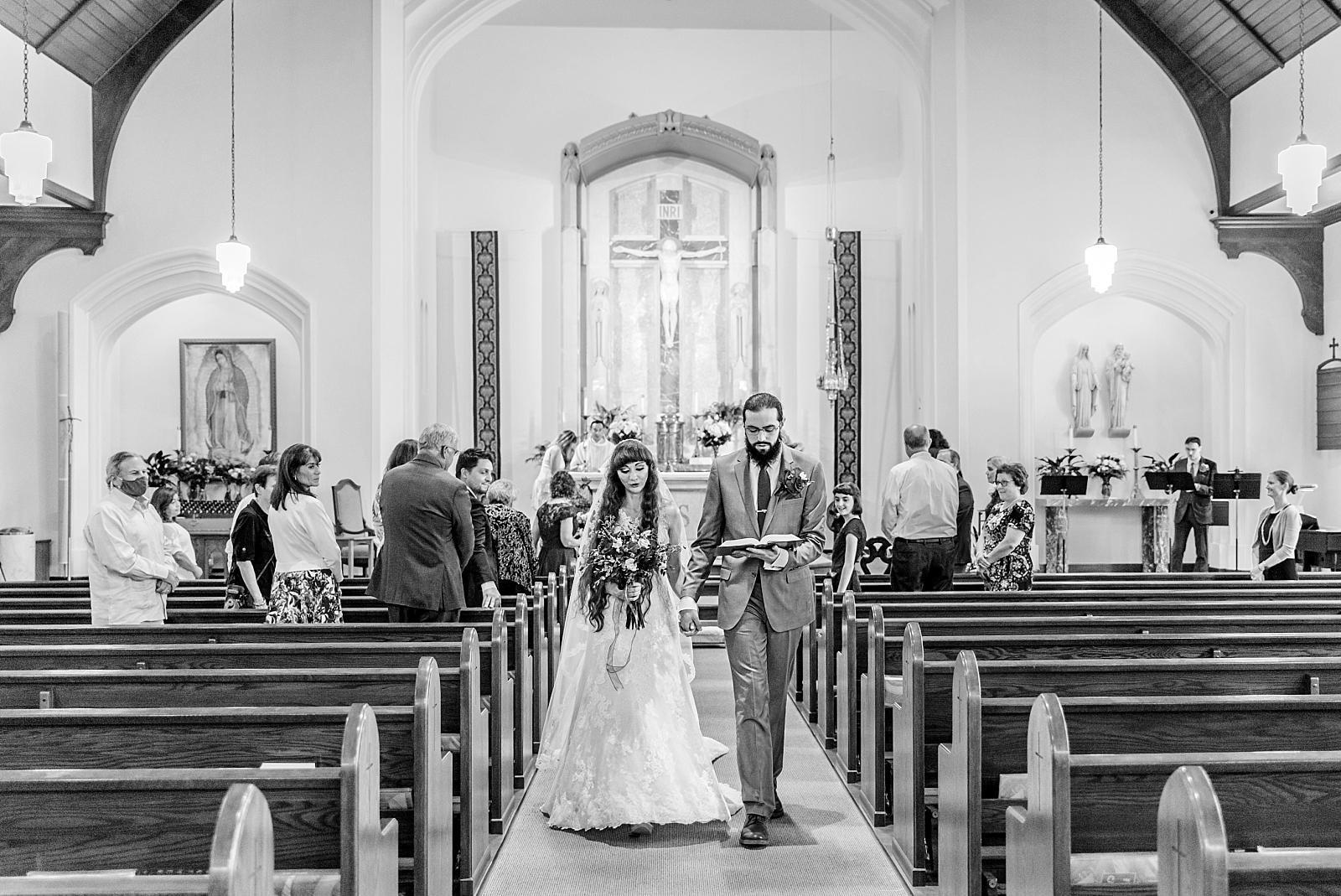 Bride and Groom walk down aisle at Holy Rosary Catholic Church