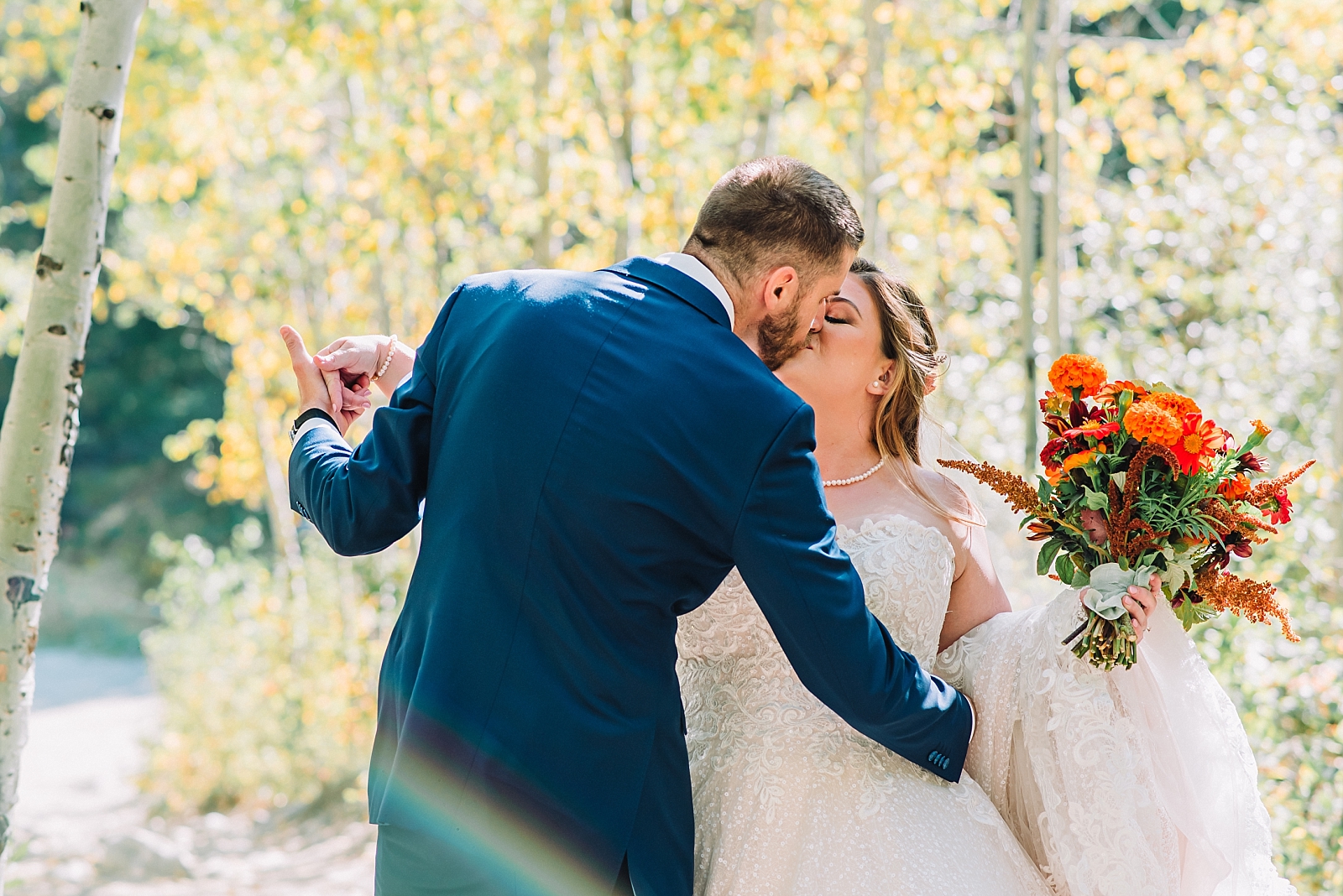 bride and groom kissing in fairytale teton elopement