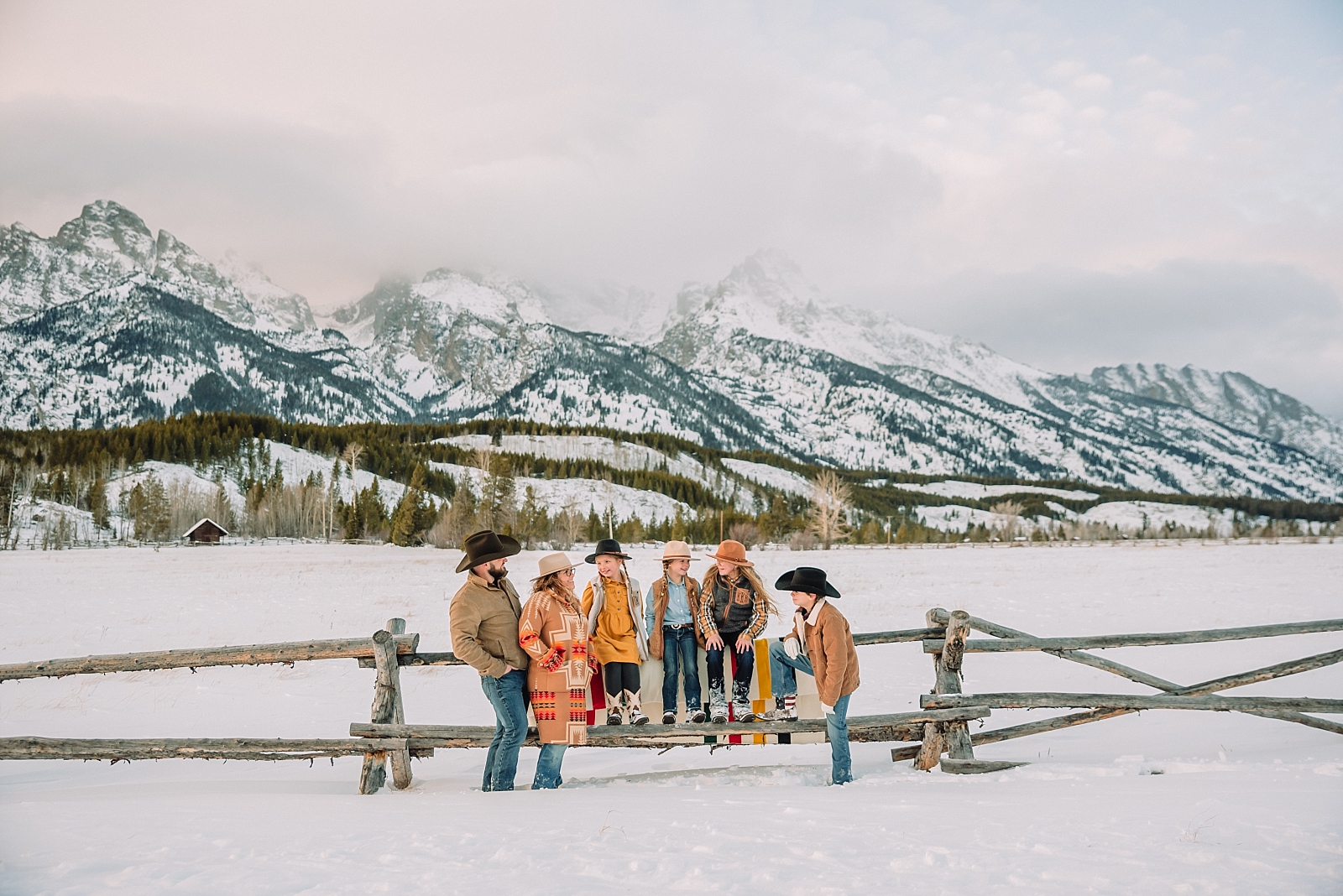 cowboy and cowgirl family winter photos in jackson hole