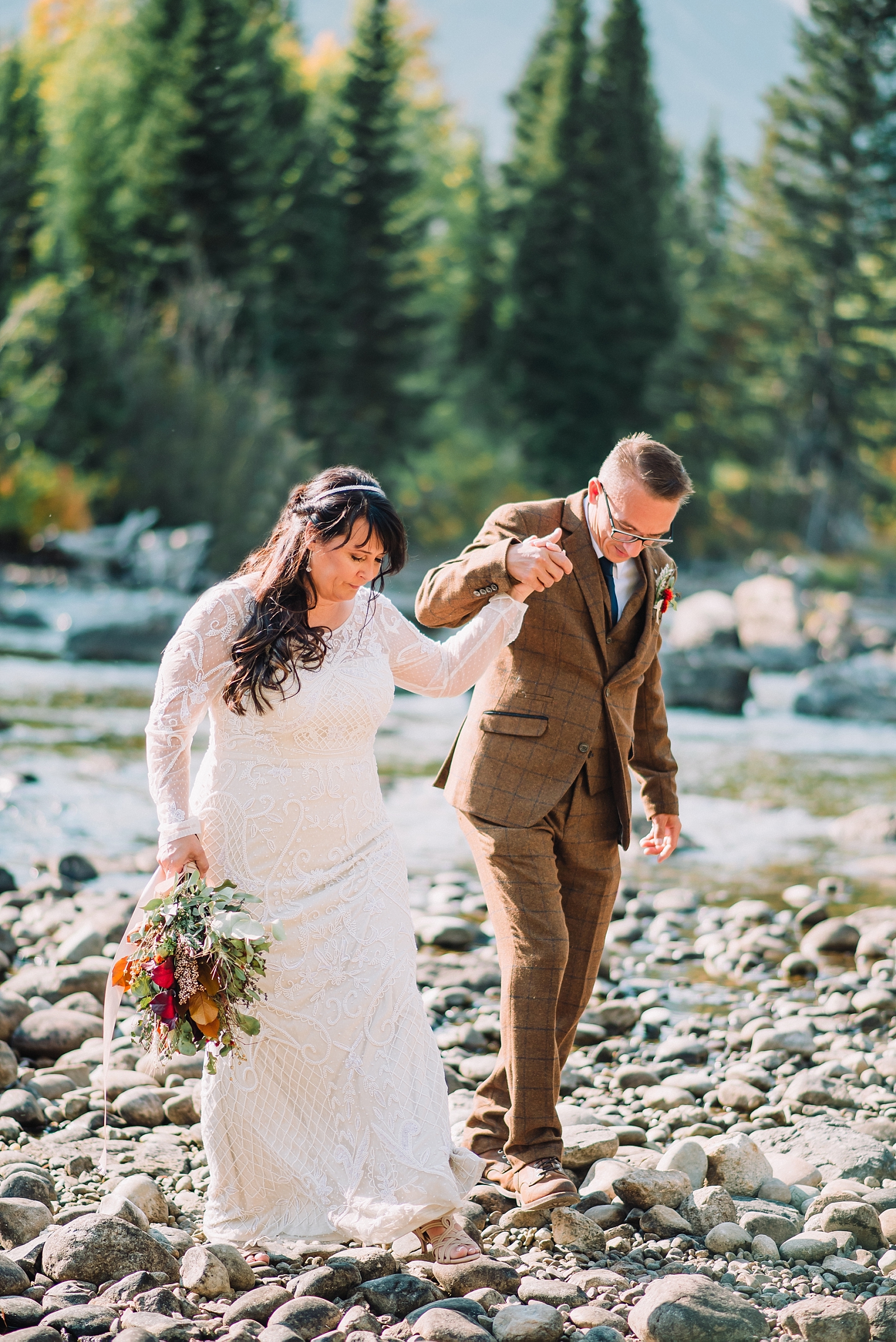 bride and groom at jenny lake river mountains