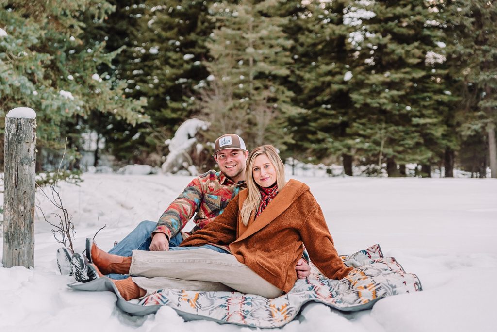 couple in the snow and mountains