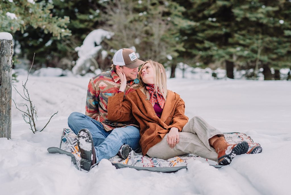 couple in the snow and mountains