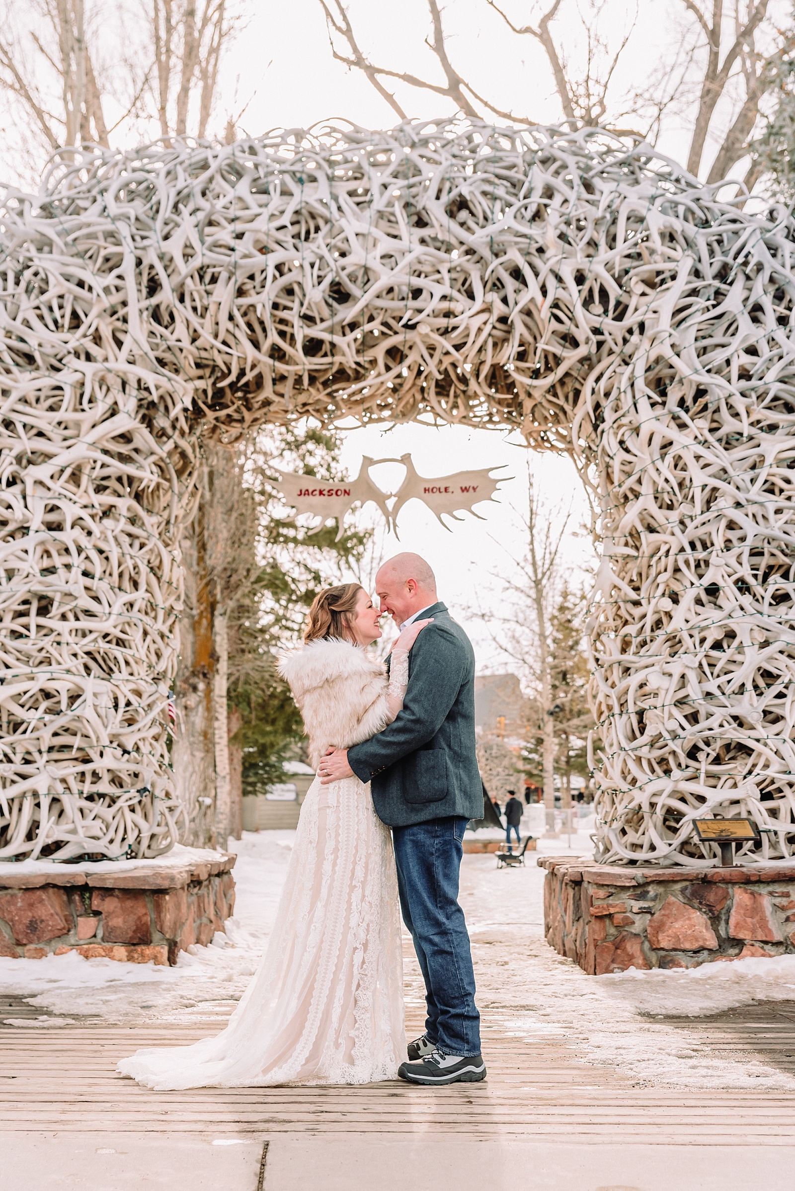 wedding photos under jackson hole antler arches
