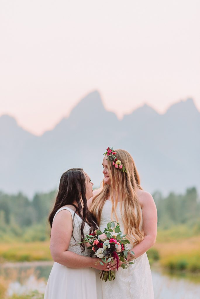 lesbian bride wears floral crown on wedding day