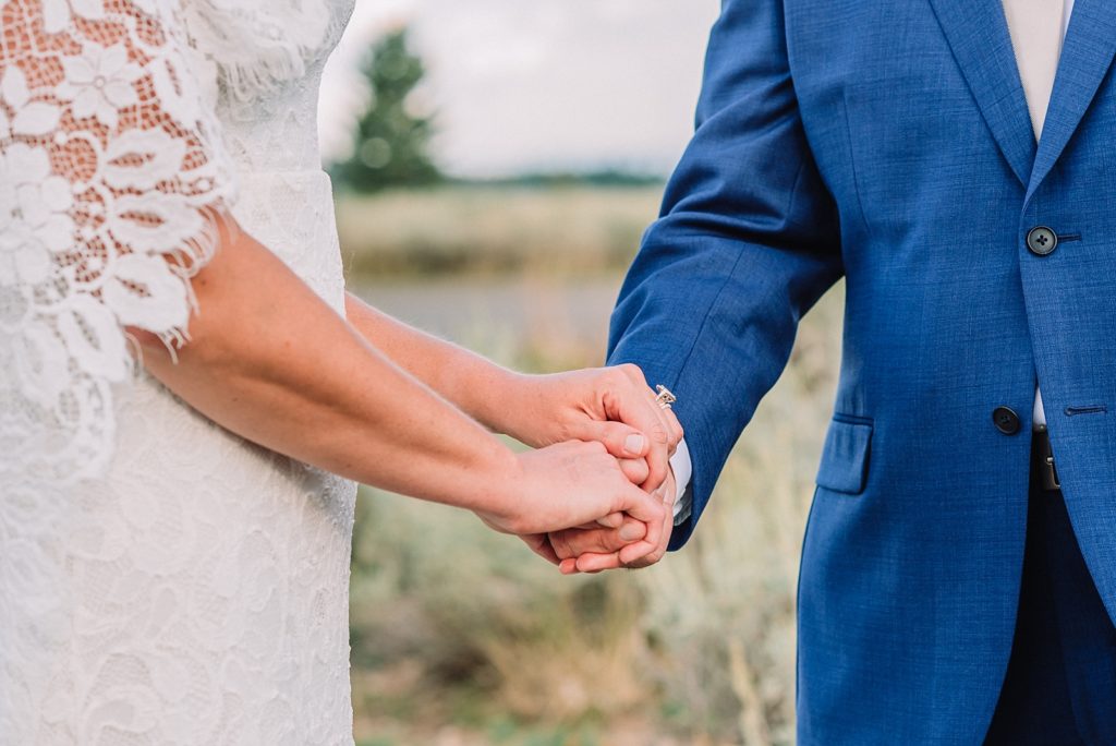 couple holding hands during elopement