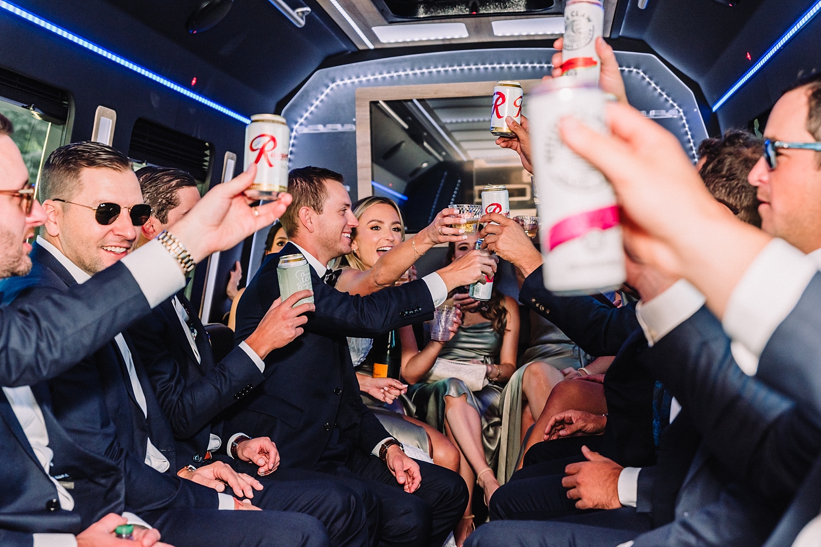 Bridesmaids and Groomsmen in party bus at wedding