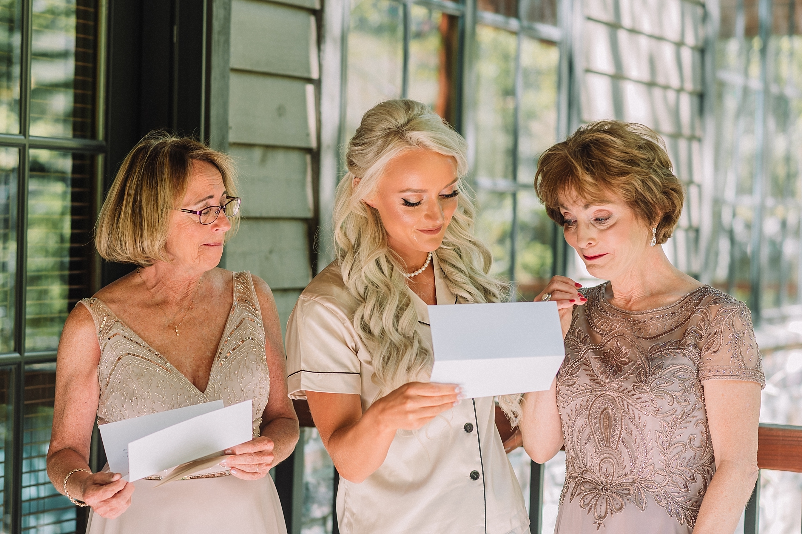 Bride reads letters to her mother and mother in law before wedding