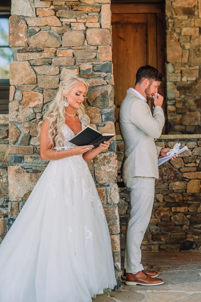 Bride and Groom read letters to each other before their ceremony, first touch on wedding day, no first look, jackson hole wedding