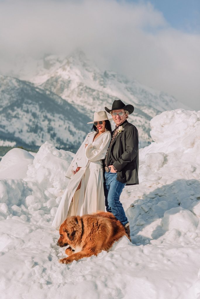 western wedding couple, wedding dresses, jackson hole wedding photography, grand teton national park elopement, winter wedding, snowy wedding, dog in wedding