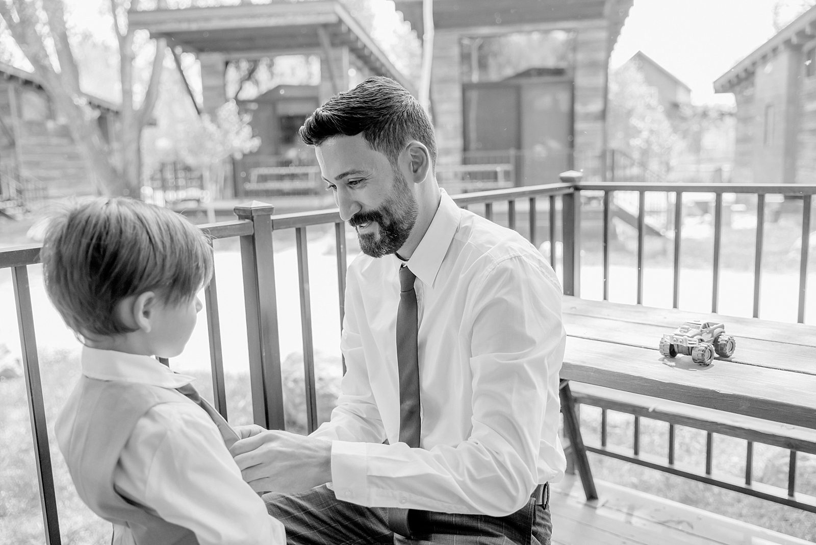 groom helps his son get ready on wedding day