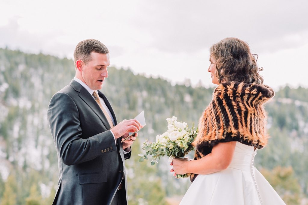 groom reads vows to bride in jackson hole wedding ceremony