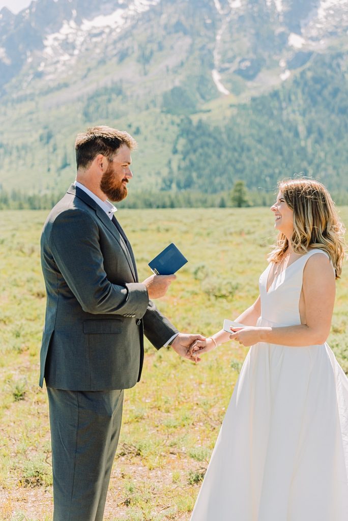 bride and groom share wedding vows under the Teton mountain peaks