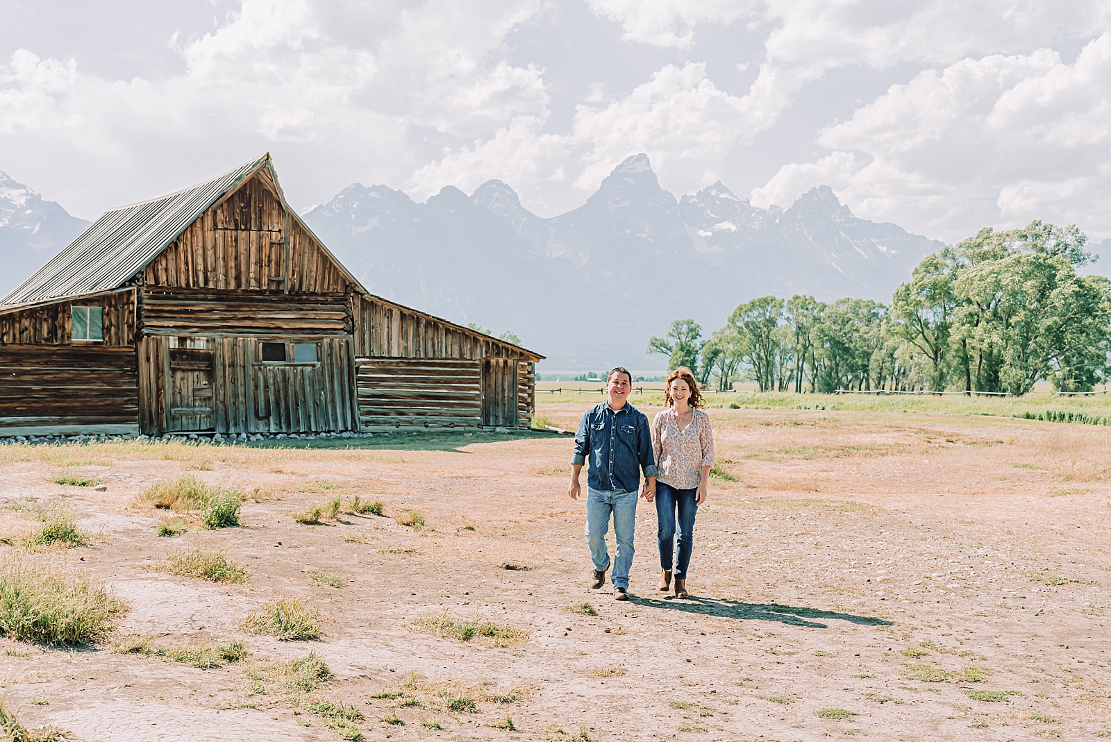 couple posing by the TA MOULTON BARN in Jackson Wy