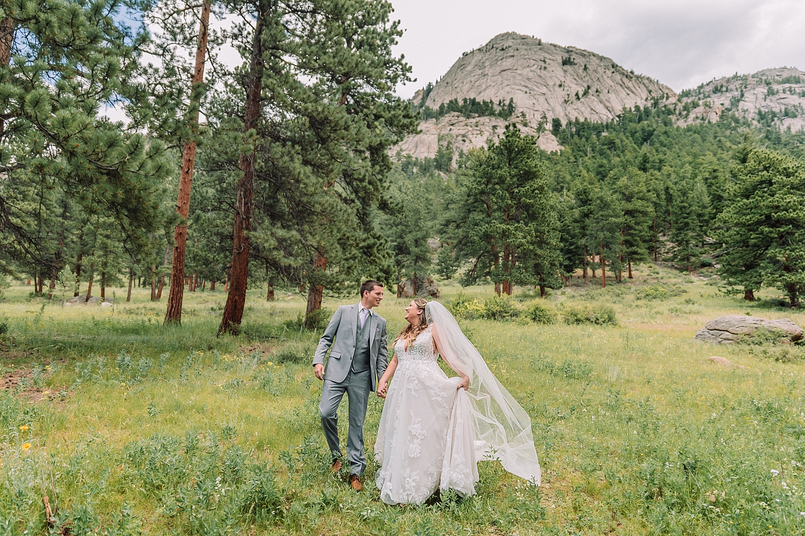 first look with groom and bride, della terra mountain chateau, estes park colorado wedding photographer