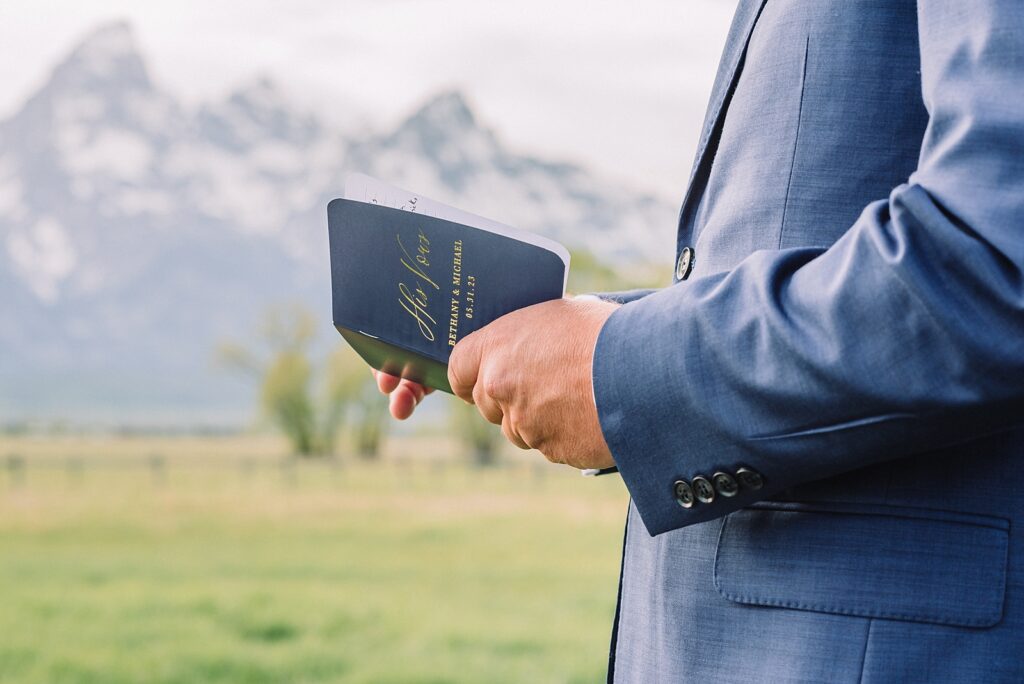 Mormon Row Spring Elopement, Jackson hole wedding photographer, religious wedding ceremony, personal vow reading in outdoor wedding, grand teton national park elopement