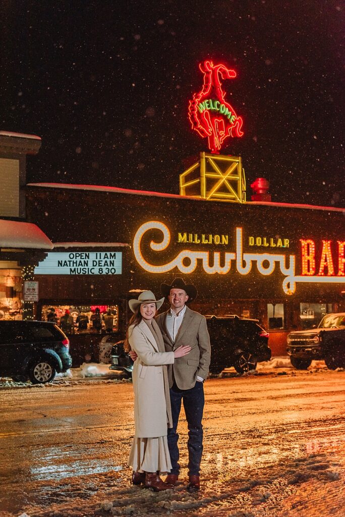 cowboy bar elopement photos at night with the neon lights