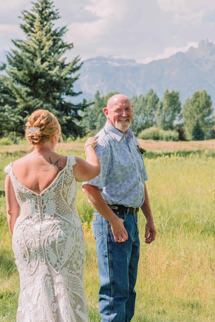 first look with bride and her dad on wedding day in the mountains