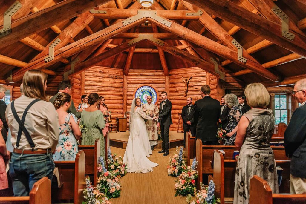 indoor wedding ceremony, chapel of the sacred heart catholic wedding, wedding photographer in jackson hole