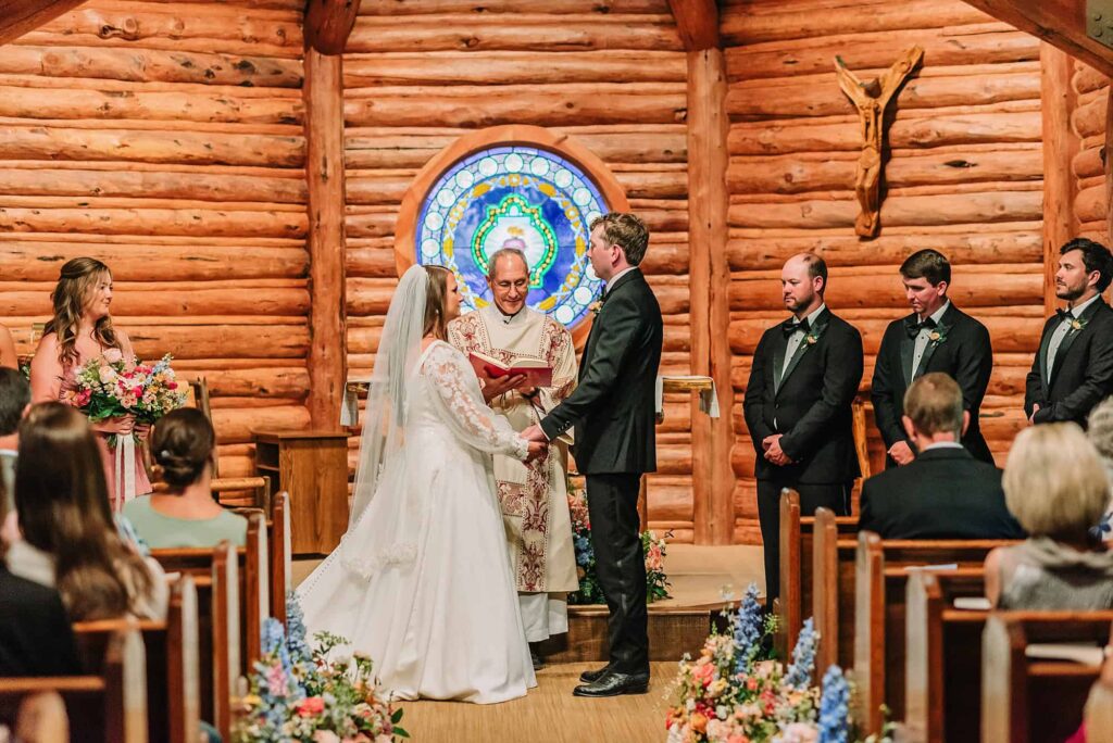 indoor wedding ceremony, chapel of the sacred heart catholic wedding, wedding photographer in jackson hole