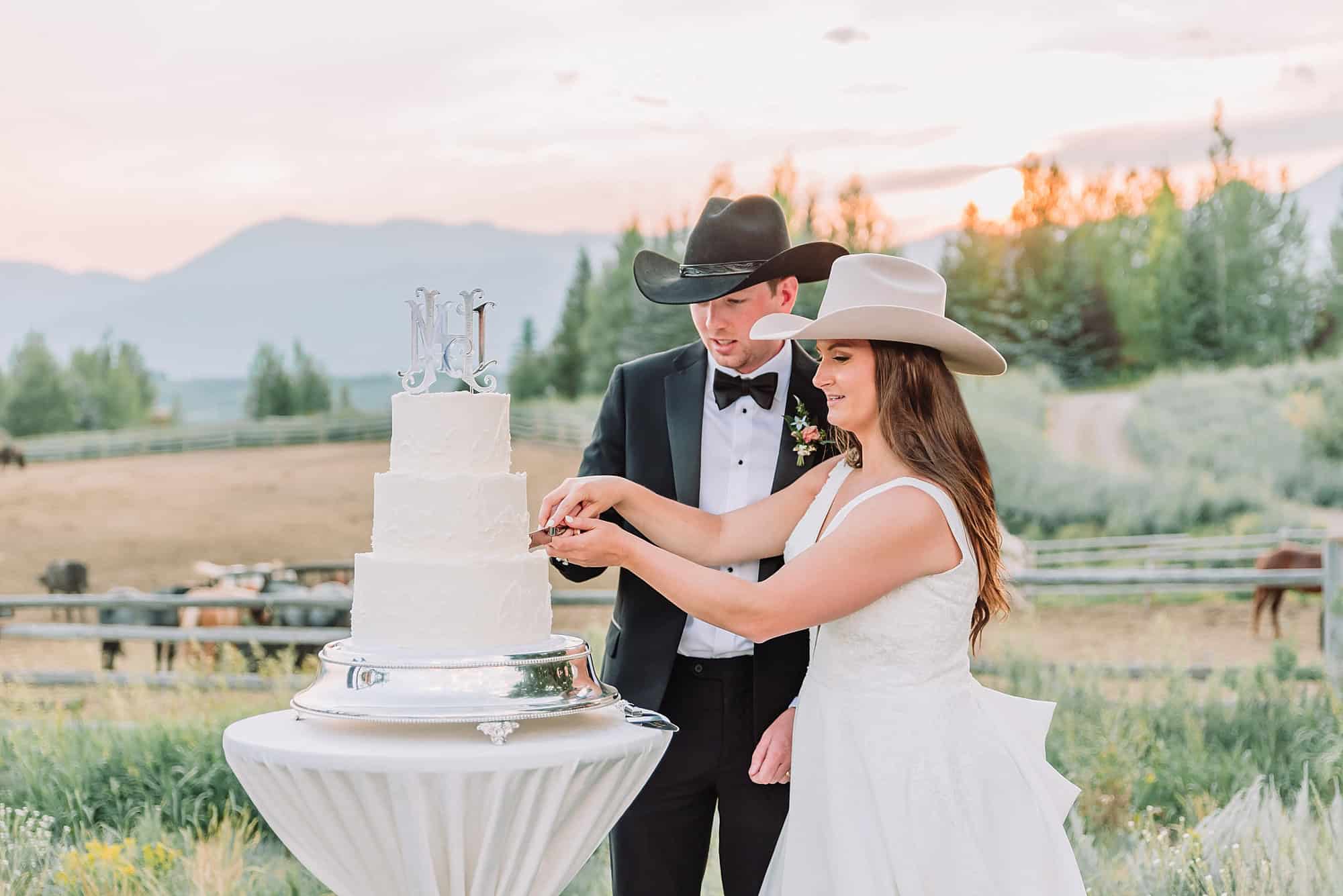 cake cutting at spring creek ranch wedding venue in jackson hole wyoming