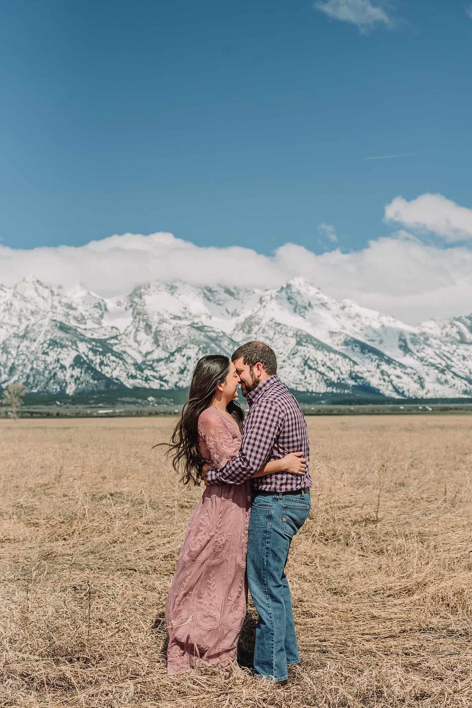 spring engagements in the snow, jackson hole engagement photographer, jackson hole photographer, photography in grand teton national park, wyoming photographer, destination photographer, spring outfit ideas