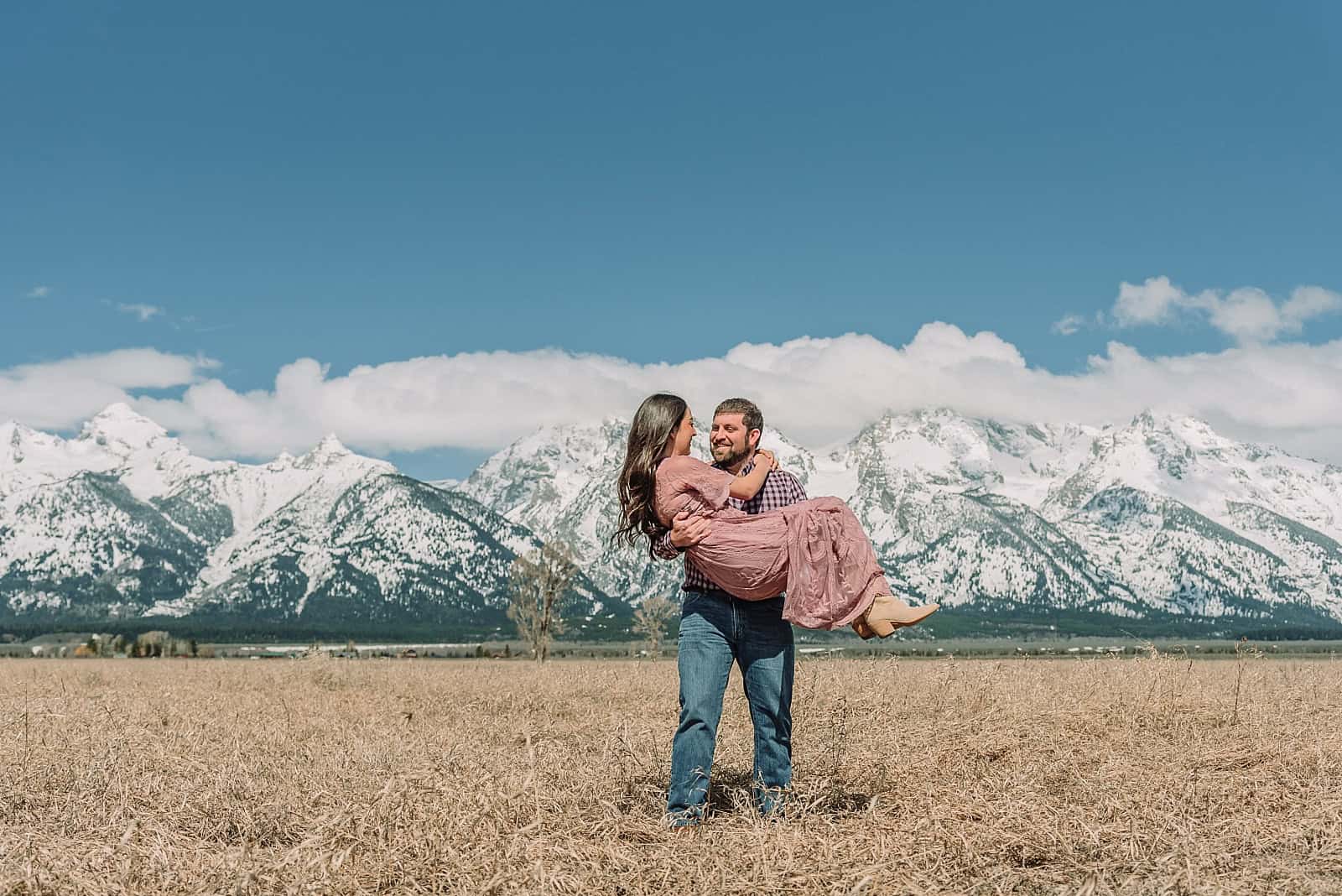 spring engagements in the snow, jackson hole engagement photographer, jackson hole photographer, photography in grand teton national park, wyoming photographer, destination photographer, spring outfit ideas