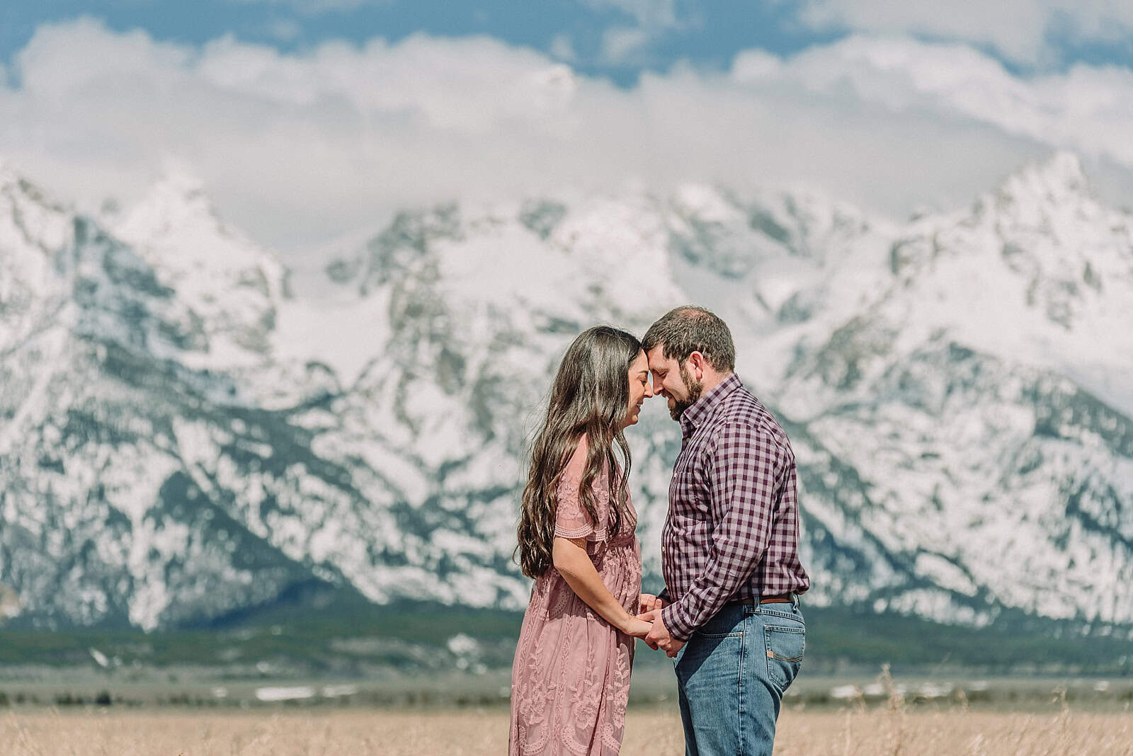 spring engagements in the snow, jackson hole engagement photographer, jackson hole photographer, photography in grand teton national park, wyoming photographer, destination photographer, spring outfit ideas