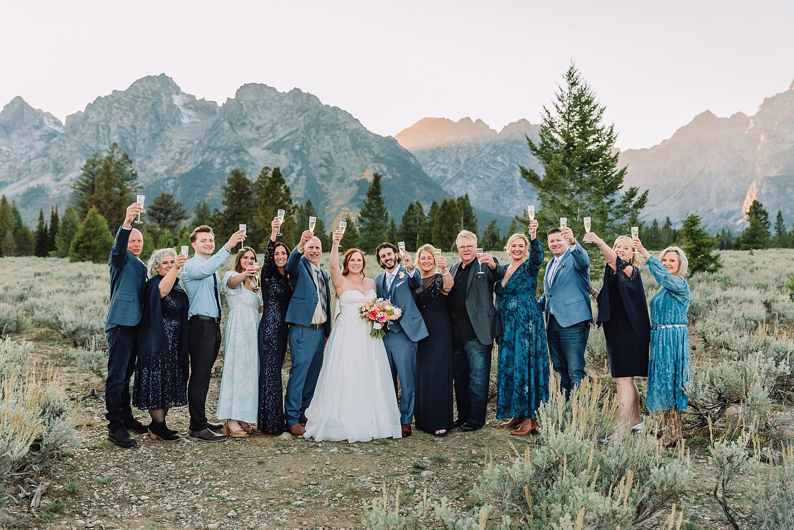 Champagne toast ideas for outdoor wedding Grand Teton Elopement Photographer romantic wedding dresses outdoor wedding small intimate wedding ideas mountain wedding nature wedding timeless wedding classy wedding elopement elopement photography destination wedding Jackson Hole Wedding Photographer mountain view turnout wedding