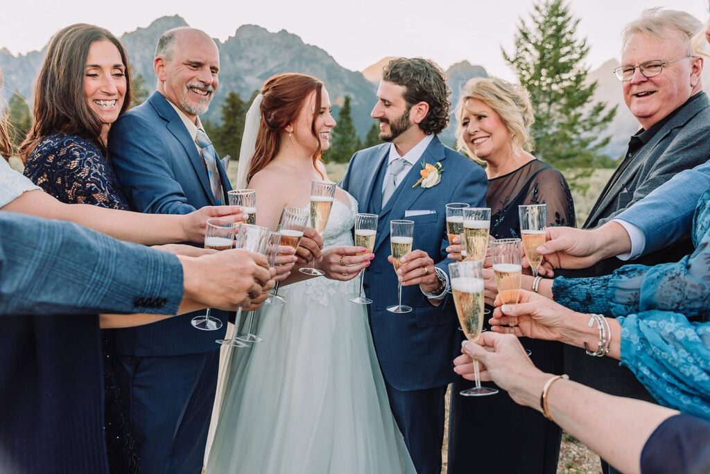 Champagne toast Grand Teton Elopement Photographer romantic wedding dresses outdoor wedding small intimate wedding ideas mountain wedding nature wedding timeless wedding classy wedding elopement elopement photography destination wedding Jackson Hole Wedding Photographer mountain view turnout wedding