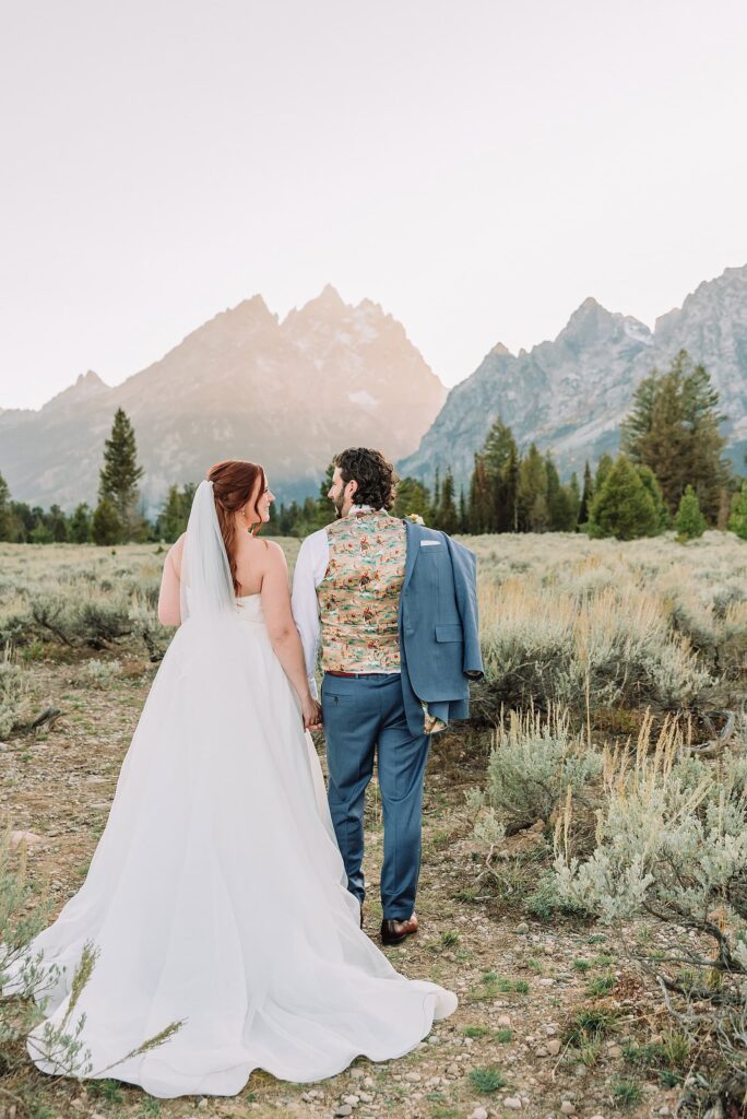 custom interior jacket lining for groom on wedding day Grand Teton Elopement Photographer romantic wedding dresses outdoor wedding small intimate wedding ideas mountain wedding nature wedding timeless wedding classy wedding elopement elopement photography destination wedding Jackson Hole Wedding Photographer mountain view turnout wedding